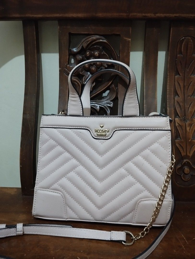 Secosana Quilted Handbag with Chain Strap (Category: Shoulder Bags) located in Manila. Submitted by ljaneee (Listing ID 1454438245, Image 3). Description: - Secosana handbag in light pink/beige - Elegant quilted chevron pattern on the front - Comfortable top handles - Includes a detachable chain strap for versatile wear - Stylish gold hardware details - Subtle Secosana logo on the front - Ideal for everyday use or evening events.