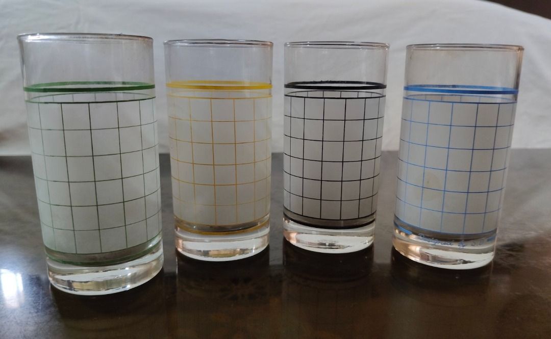 Xmas Discount!!! Set of 4 Vintage Grid Pattern Drinking Glasses Different Colors (Category: Dinnerware & Cutlery) located in Quezon City. Submitted by oddduck02 (Listing ID 1454531077, Image 2). Description: - Set of 4 Vintage Drinking glasses with grid pattern - Each glass has unique colored bands: green, yellow, black, and blue - Has a retro vibe - Approximate Size = 10 1/2cm tall - Reason for selling = Cleaning house .