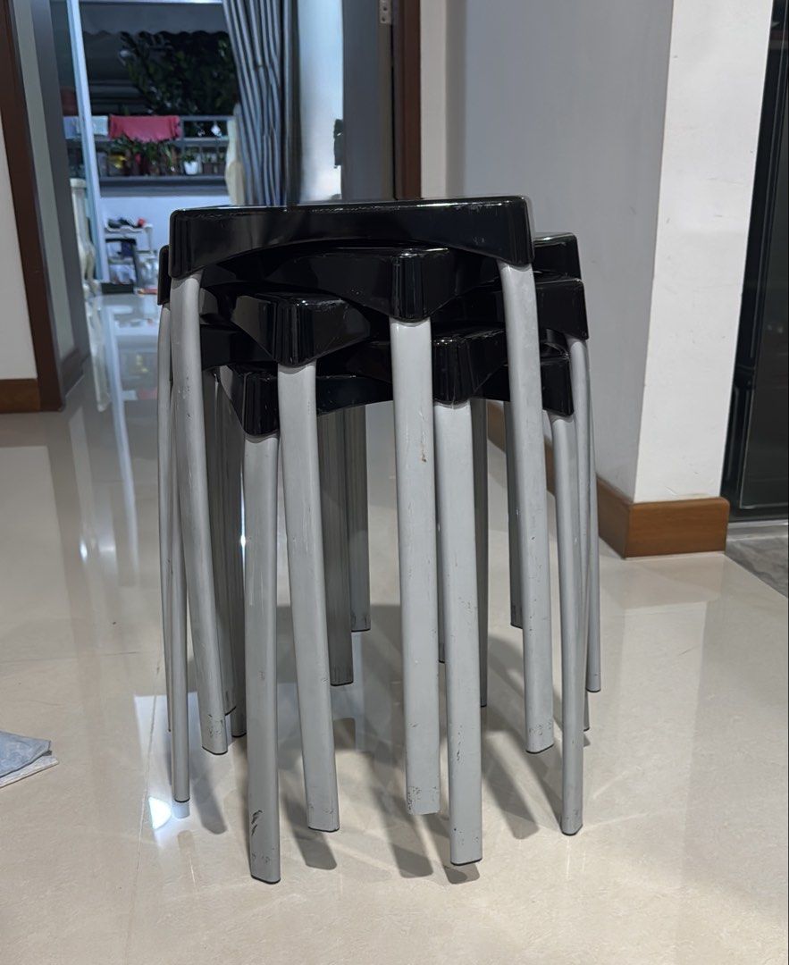 Stackable Plastic Stools (5 pcs) (Category: Chairs) located in Singapore. Submitted by tgk1969 (Listing ID 1454369768, Image 1). Description: - 5 stackable stools - Color: Black seat, grey leg - Ideal for extra seating at home or for events - Stacks neatly for convenient storage - Minor scuffs on legs from normal use - Sturdy and fully functional.