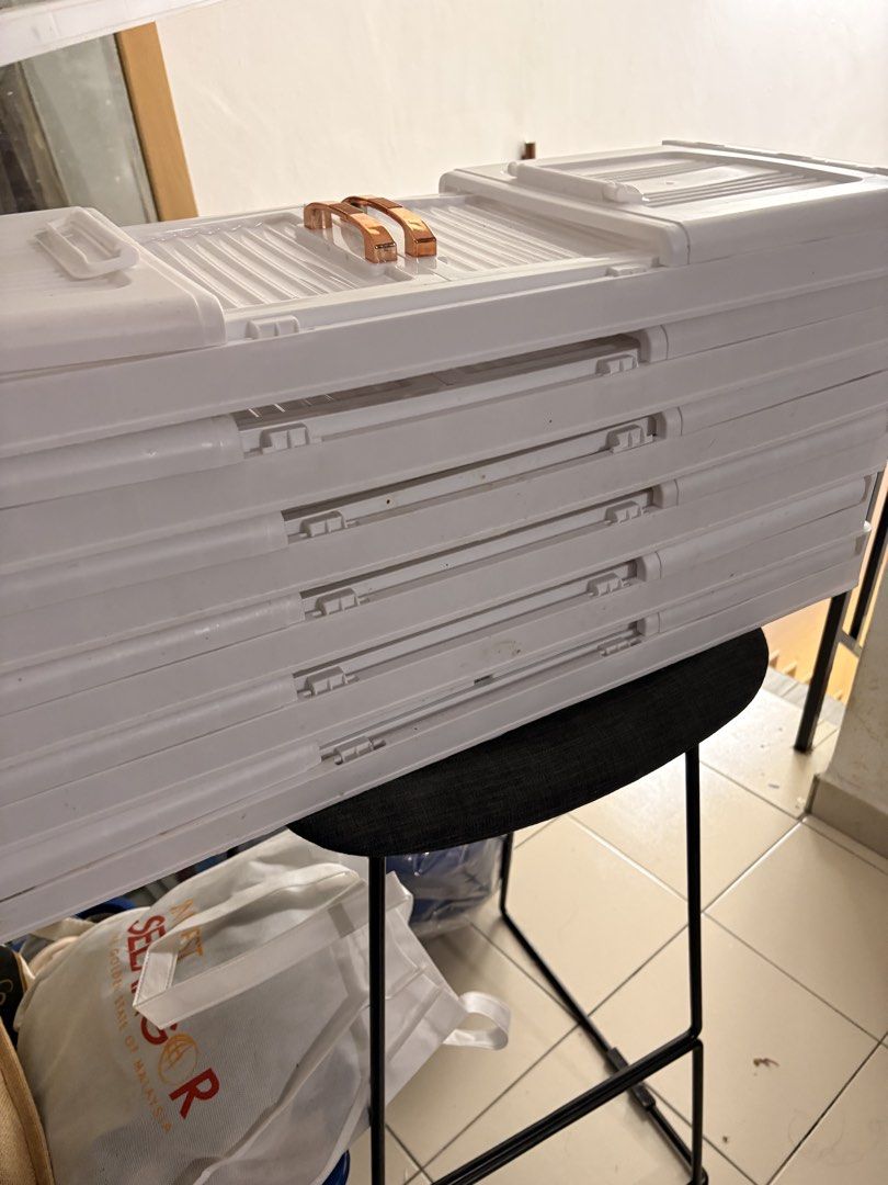 Stackable White Storage Boxes (Category: Storage Boxes & Baskets) located in Kuala Lumpur. Submitted by timefornewhome (Listing ID 1454441918, Image 1). Description: Stackable storage boxes, 6 layers, white colour, ada stains. Not for fussy taker, got broken part but can glue back (refer pic) Wheels not included NP RM130, selling for RM80 Price negotiable, URGENT SELL Pickup Kota Kemuning .