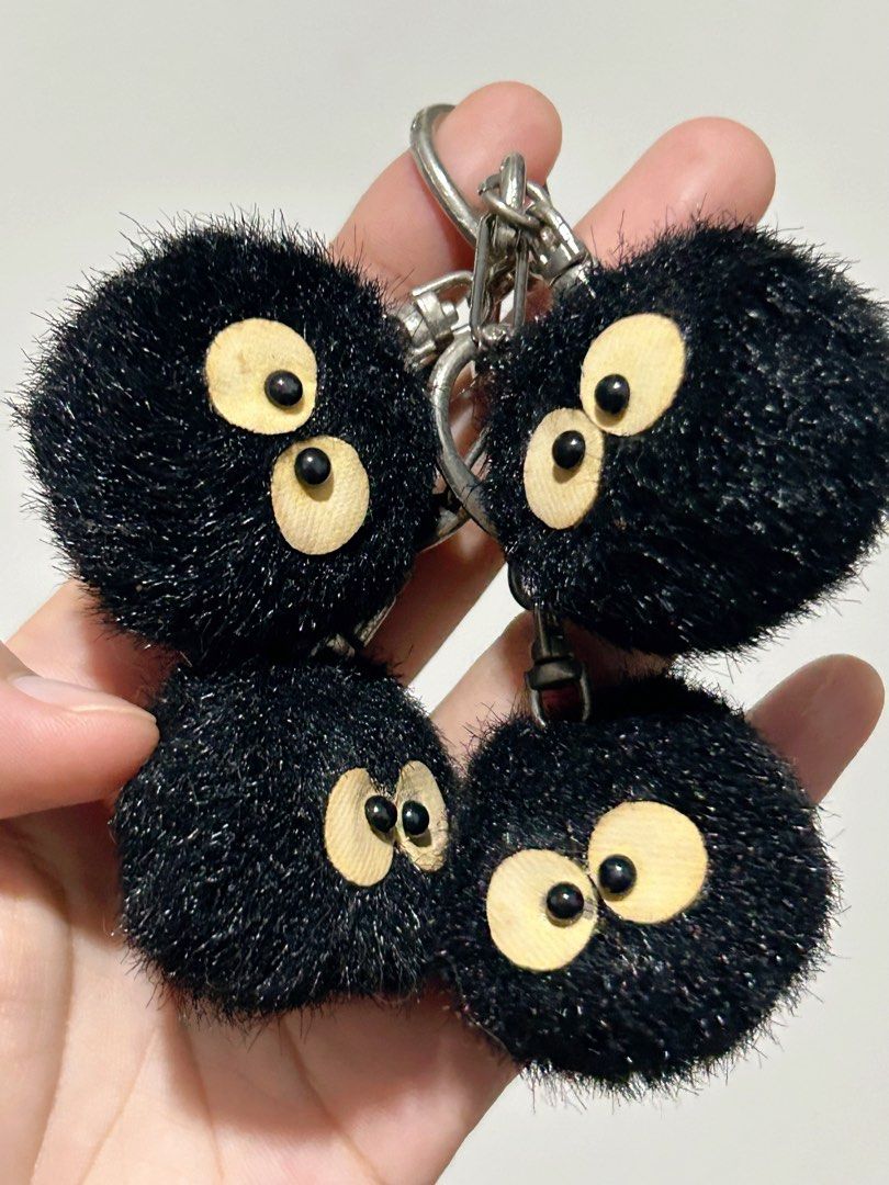 Studio Ghibli Soots Sprite Fluffy Monster Keychain Set (Category: Character Goods) located in Carcar. Submitted by creeyisla (Listing ID 1454419920, Image 1). Description: - Set of 4 fluffy black keychains -Original Merch of Sun arrow - Ideal for decorating bags or keys - Comes with hq metal keyring and clasp.