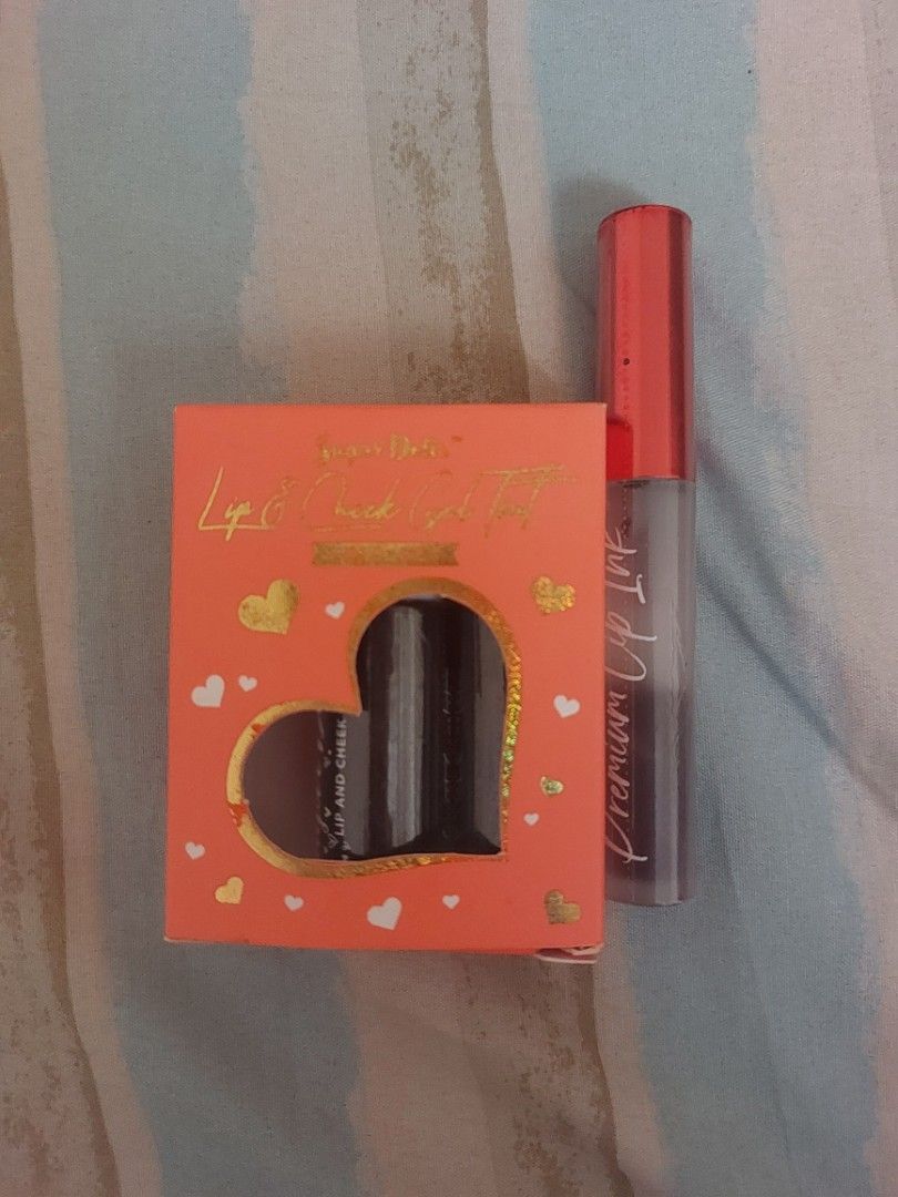 Sugar Dolls Lip & Cheek Gel Tint Set (Category: Makeup) located in Malaybalay. Submitted by mags_sofia (Listing ID 1454495934, Image 2). Description: - Comes in a cute heart-shaped box - originally a trio set but there's only 2 unused bottles left - will also include a Midnight Truffle gel tint of the same brand - Shade: Sweet Scarlet, Cherry Jelly, Midnight Truffle (longer one) - Ideal for everyday wear - Lightly used, selling them because I don