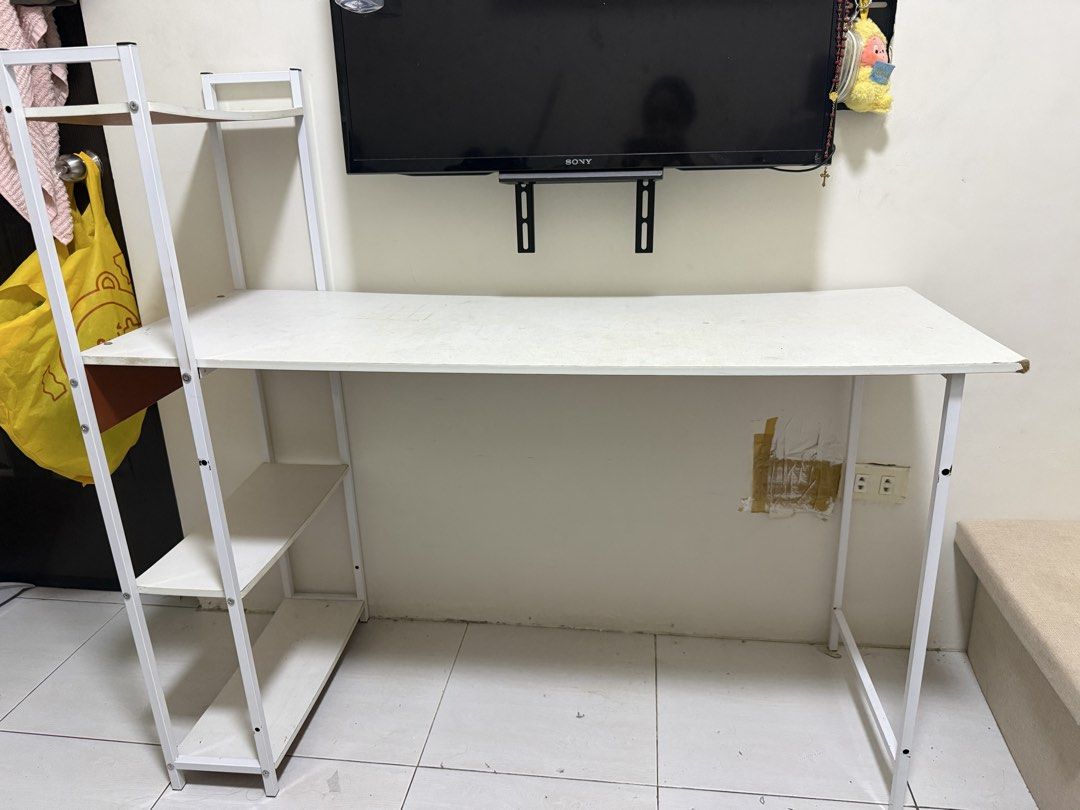 Table (Category: Tables & Sets) located in Manila. Submitted by isabelaaaai (Listing ID 1454553901, Image 1). Description: hello po baka may gustong bumili ng table na ito for ₱500 na lang. nab-bend yung paa sa kanan pero kaya pa nito maghold ng mga gamit. pwede lagyan ng anti-slip para di gumalaw. (see photo in last for proof na kaya pa patungan ng mga gamit). 📍parañaque pm or comment po. thanks 🙏.