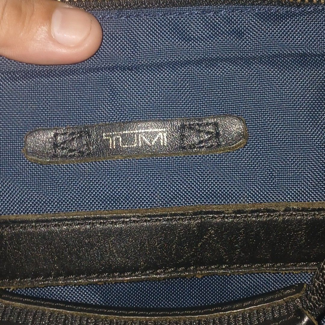 Tumi Navy Blue Ballistic Nylon Briefcase / Laptop Bag (Category: Briefcases) located in Cagayan de Oro. Submitted by susanthrifts (Listing ID 1454506263, Image 3). Description: ​Brand: Tumi ​Model / Style Ref: 61011INDOP ​Type: Briefcase / Laptop Attache / Work Bag ​Color: Navy Blue with Black Leather Trim & Dark Grey Interior ​Material: Ballistic Nylon Exterior, Nylon Lining, Genuine Leather Accents ​Features: ​Multi-compartment main interior wi