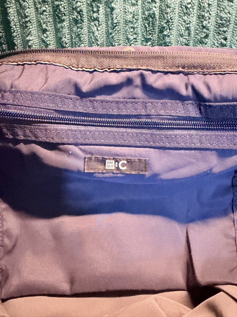 Uniqlo mini duffle bag (Category: Cross-body Bags) located in Manila. Submitted by BeachBoy (Listing ID 1454433445, Image 3). Description: Authentic Uniqlo mini duffle bag. Used several times. I had the zipper installed for security of personal items in the bag. Originally, it only has clip buttons. .