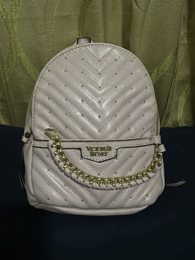 Auth Victoria's Secret Quilted Studded Mini Backpack (Category: Backpacks) located in Manila. Submitted by handpickedbyannecox (Listing ID 1454500656, Image 1). Description: - Cute pink mini backpack from Victoria's Secret - Quilted chevron pattern with all-over stud details - Gold chain detail on the front pocket - Zips open for storage - Perfect for carrying your essentials - With signs of usage ❌Bawal sa maarte❌ ❌No COD❌ .