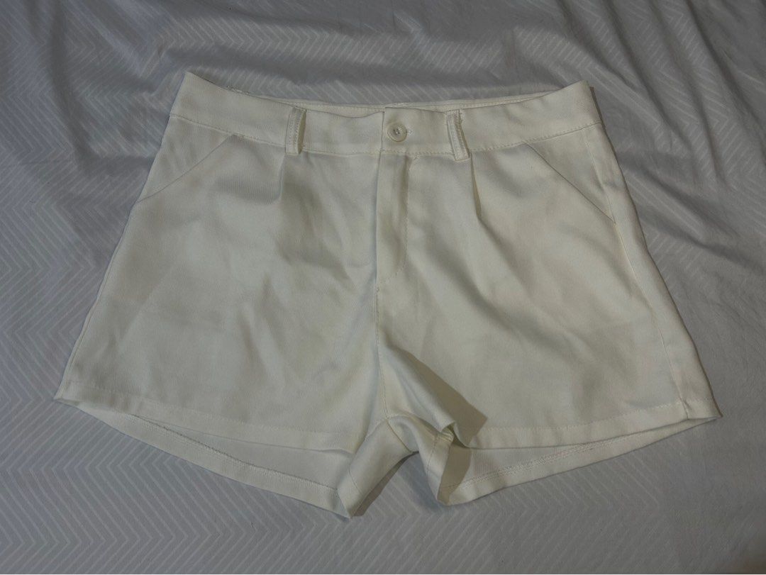 White High-Waisted Tailored Shorts (Category: Shorts) located in Manila. Submitted by fromrie (Listing ID 1454486490, Image 1). Description: - Classic white tailored shorts - High-waisted fit - Button and zip closure - Two front pockets - Simple and versatile design - Perfect for dressing up or down - Measurements available in photos fits 29-30 a bit sheer but perfect for cover ups.