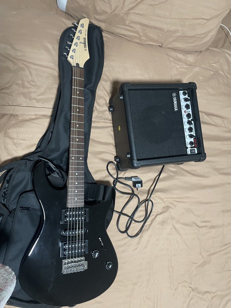 Yamaha Electric Guitar ERG 121C with Amplifier (Category: Musical Instruments) located in Quezon City. Submitted by sparkleph (Listing ID 1454392149, Image 2). Description: Bought only last Jan Rarely used Comes with amplifier, guitar bag, tuner, picks, and extra string Rfs: not using.