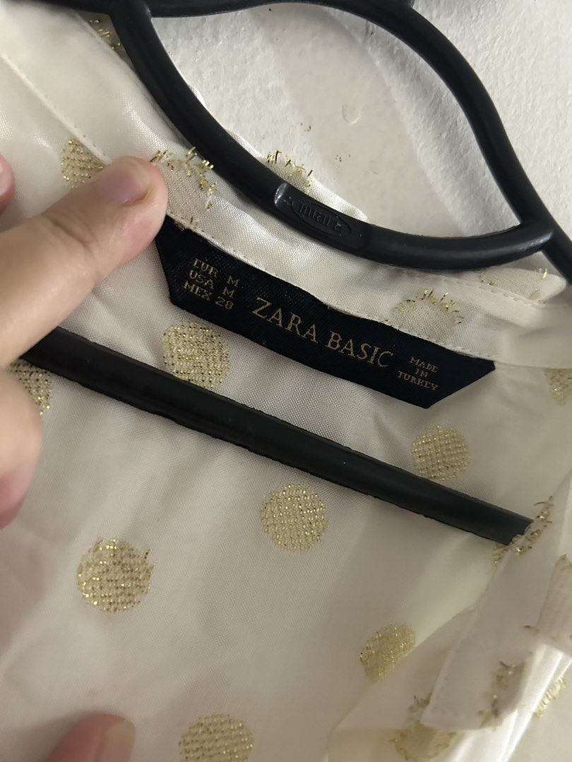 Zara Basic White Gold Polka Dot Button Up Shirt (Category: Shirts) located in Sorsogon. Submitted by jonacel (Listing ID 1454466777, Image 2). Description: - Zara Basic white button-up shirt - Subtle gold polka dot pattern - Long sleeves - Size M (EUR/USA/MEX) - Made in Turkey - Perfect for dressing up or down.