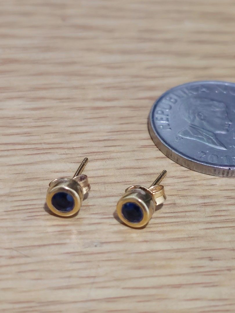 18k Gold Sapphire Stud Earrings (Category: Earrings) located in Caloocan City. Submitted by smart_shoppers_ville (Listing ID 1454708340, Image 1). Description: - Genuine 18k gold stud earrings - Features a round, deep blue sapphire stone - 1.5 grams - Secure bezel setting - Classic and timeless design - Versatile for everyday or special occasions - Small and delicate size - Comfortable butterfly clasps.