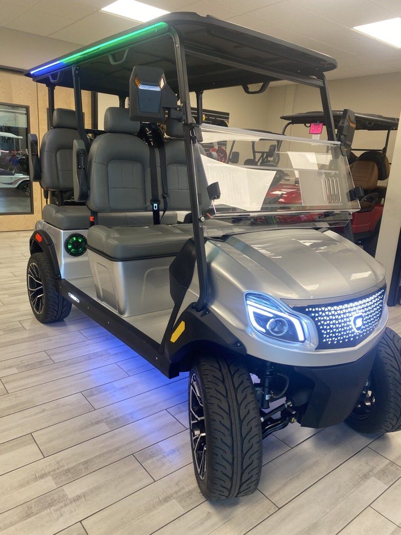 4-Seater Silver Electric Golf Cart with Custom Lighting (Category: Golf) located in Laoag. Submitted by silvershark_0dfaf9 (Listing ID 1454716204, Image 2). Description: - 4-seater electric golf cart - Sleek silver exterior with black accents - Modern digital dashboard (speed & power) - Custom LED undercarriage and roof lighting (green/blue options) - Comfortable grey seating for all passengers - Ideal for golf courses or community transport.