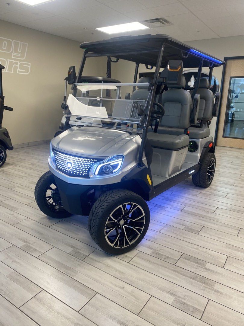 4-Seater Silver Electric Golf Cart with Custom Lighting (Category: Golf) located in Laoag. Submitted by silvershark_0dfaf9 (Listing ID 1454716204, Image 3). Description: - 4-seater electric golf cart - Sleek silver exterior with black accents - Modern digital dashboard (speed & power) - Custom LED undercarriage and roof lighting (green/blue options) - Comfortable grey seating for all passengers - Ideal for golf courses or community transport.