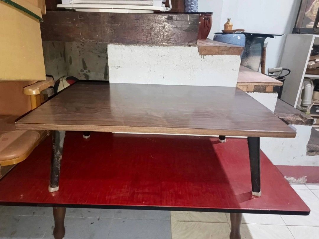 🪑 Foldable Coffee Center Table – Wood Finish (Category: Tables & Sets) located in Cebu City. Submitted by turuuru8992423 (Listing ID 1454647074, Image 3). Description: 🪑 Foldable Coffee Center Table – Wood Finish 📏 Dimensions: L90 x W60 x H31 cm Description: Selling a used but sturdy foldable coffee table with a classic wood grain finish. Perfect for small spaces, apartments, or as a temporary table for gatherings, crafts, or even outdoor use.