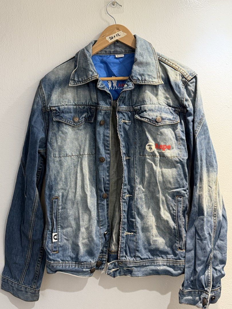 AAPE by A Bathing Ape Denim Jacket | Blue (Category: Coats, Jackets and Outerwear) located in Bulacan. Submitted by surewinstuff (Listing ID 1454745463, Image 1). Description: AAPE by A Bathing Ape denim jacket in blue with signature AAPE logo details and blue inner lining. Nice vintage/wash effect. Condition: Good pre-loved condition; with small tear/fraying at back (see photos) Measurement: 26” length x 22” width.