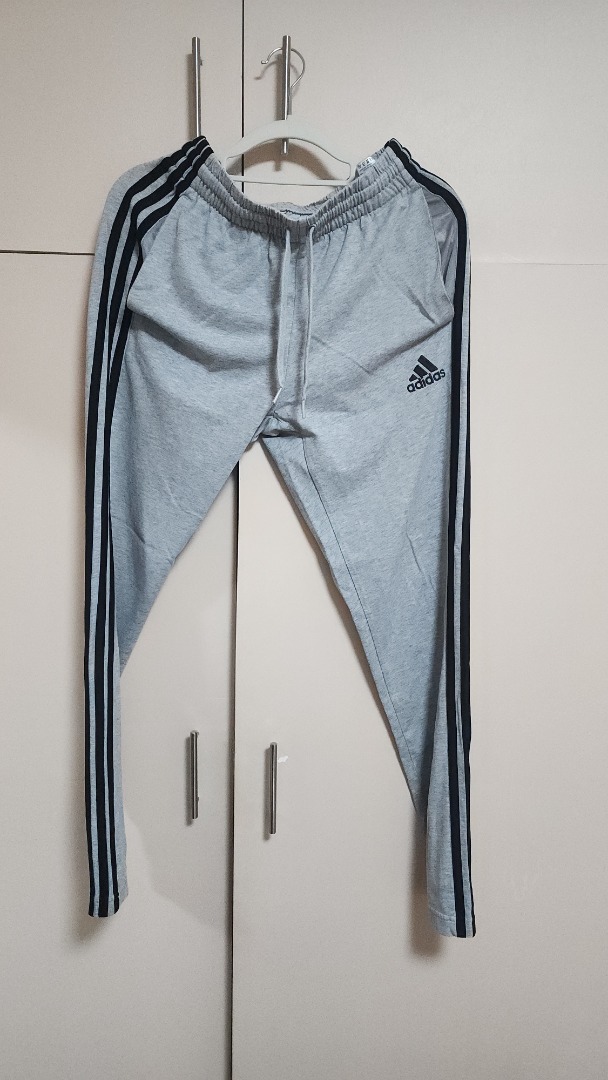 Adidas Grey Slim Three Stripes Jogger Pants (Category: Joggers) located in Mandaluyong City. Submitted by declutteriz (Listing ID 1454732115, Image 1). Description: -Size M on tag -10/10 condition -Preloved item -PM for measurements -Shipping fee not included.