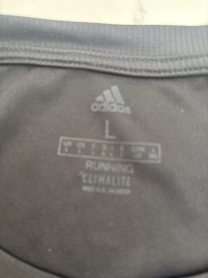 Adidas Running Climalite T-shirt Size L (Category: Activewear) located in Muntinlupa City. Submitted by nicethingsforsale1 (Listing ID 1454566263, Image 2). Description: - Grey Adidas t-shirt - Size: L - Climalite fabric for moisture-wicking - Perfect for running, workouts, or casual wear.