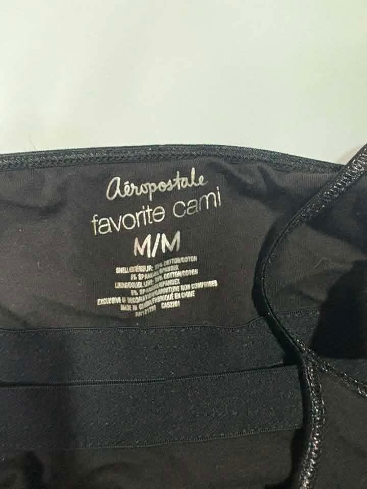 Aeropostale Black Sequin Logo Favorite Cami M/M (Category: Sleeveless) located in Quezon City. Submitted by fairy_luna (Listing ID 1454729554, Image 3). Description: - Black Aeropostale cami top - Features colorful sequin Aeropostale logo - Adjustable spaghetti straps - X Small to Small - no issues - w tag - Comfortable cotton and spandex blend - Versatile for layering or standalone wear.