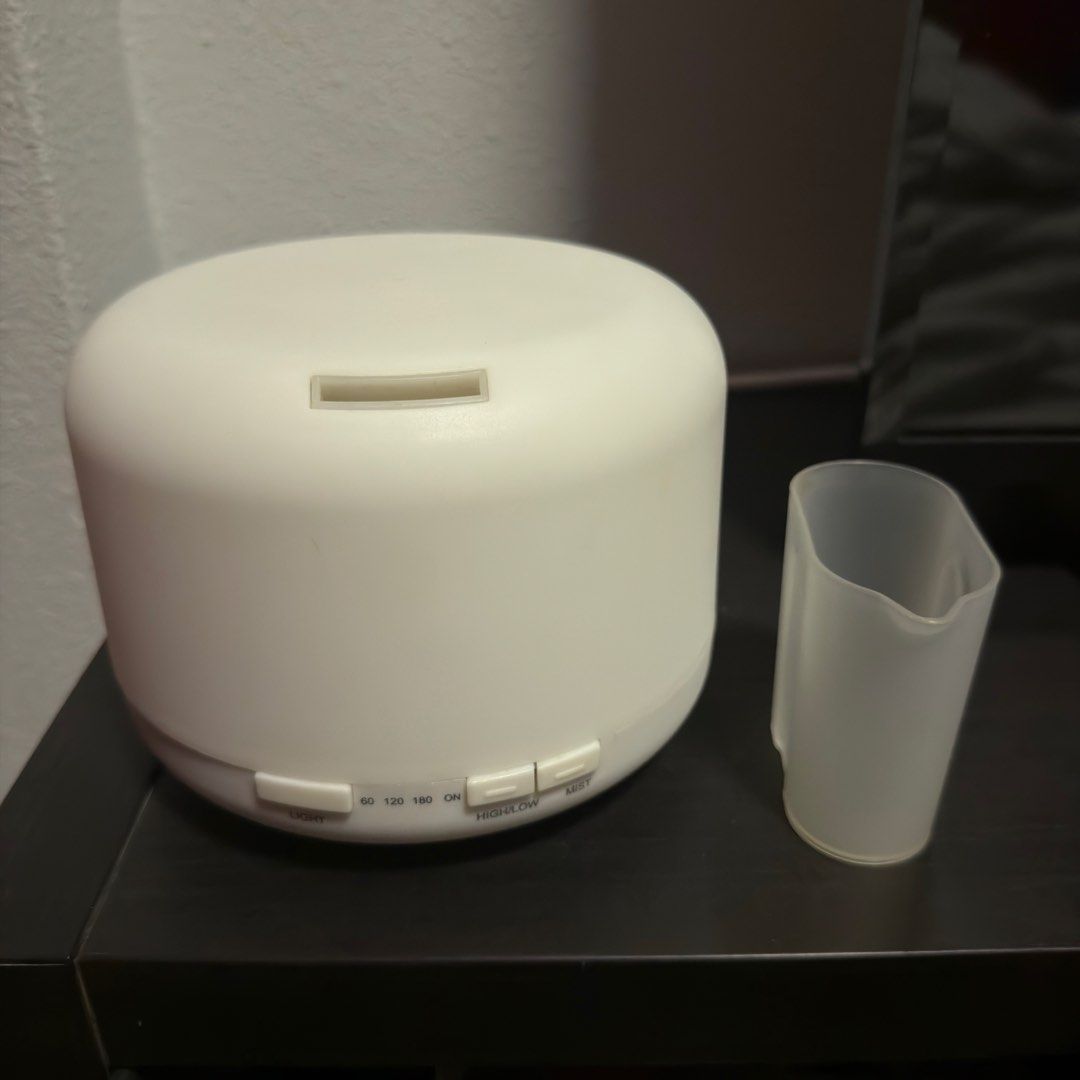 Aroma Diffuser (without power plug) (Category: Home Fragrance) located in Singapore. Submitted by valensia_s (Listing ID 1454657879, Image 1). Description: - Please note: Does not come with power plug!!! - White aroma diffuser - Compact and modern design - Easy to use with included measuring cup - Suitable for home or office use - Will give a few oil for free.