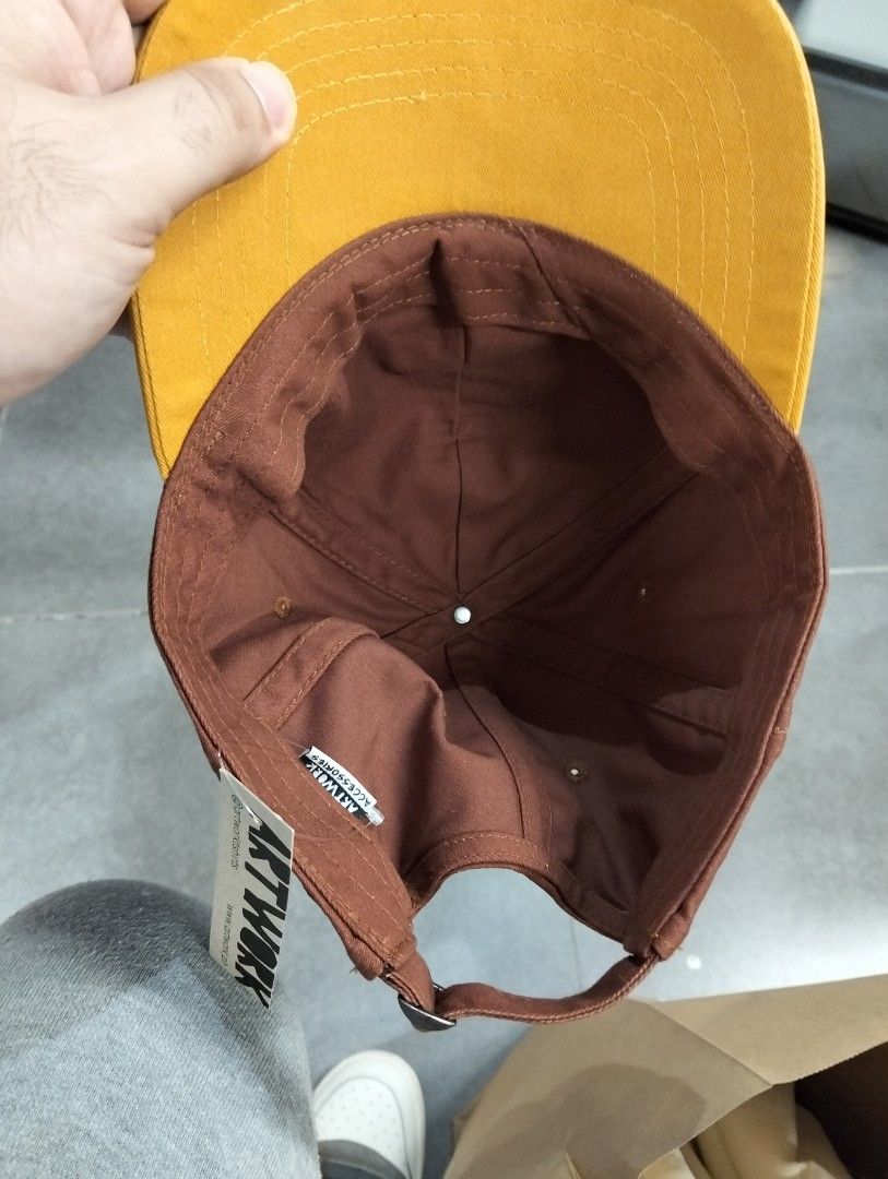 ARTWORK Cherry Embroidered Brown & Yellow Baseball Cap (Category: Caps & Hats) located in Nabunturan. Submitted by rollingon22 (Listing ID 1454635156, Image 2). Description: - Brand: ARTWORK completely brand new, never used with tag - Color: Brown cap with yellow brim - Design: Embroidered cherry on front - Features: Adjustable strap for a custom fit - Style: Casual wear .