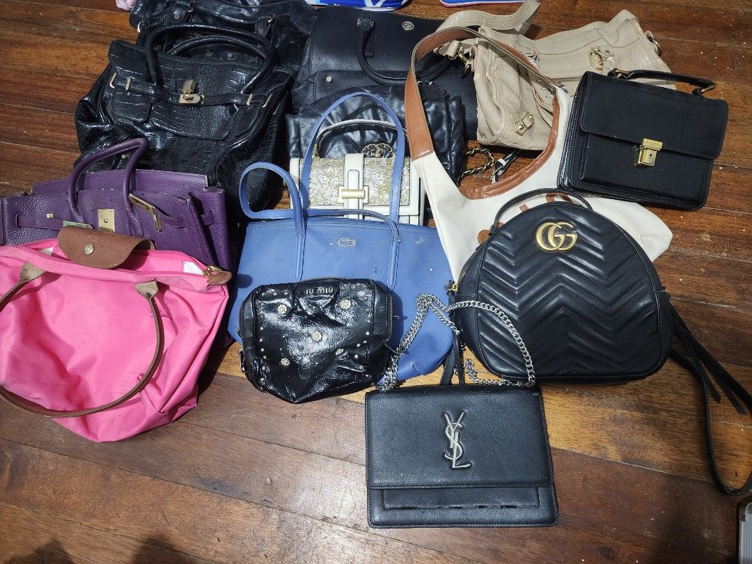 Assorted Designer Handbags Bundle - Gucci, YSL, Lacoste, Longchamp (Category: Luxury Bags & Wallets) located in Manila. Submitted by wenavillegas0703 (Listing ID 1454718448, Image 1). Description: Bundle of 14 ukay bags managed your expectation all have some major flaws.. Rfs: need declutter no space to my room na. - Includes: Black Gucci Marmont, Black YSL clutch, Blue Lacoste tote, Pink Longchamp tote, Purple structured bag, Black Miu Miu studd