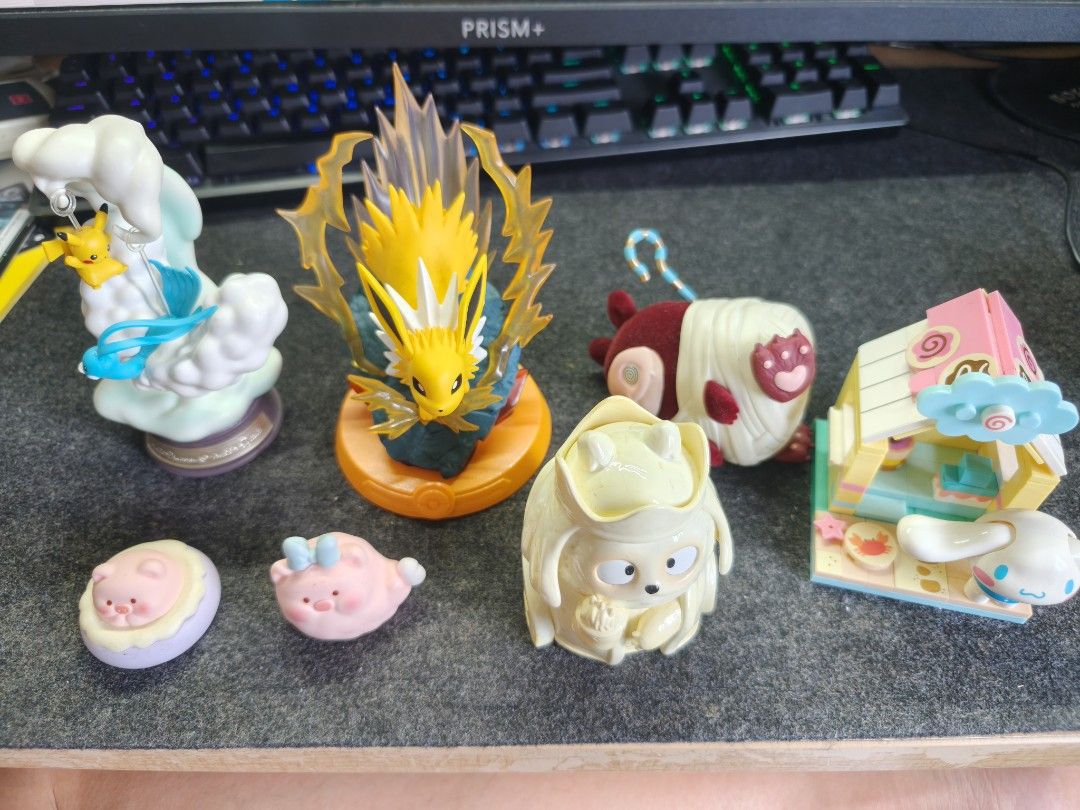 Assorted/Multiple Figurines (Category: Designer & Blind Box Toys) located in Singapore. Submitted by bardcollector (Listing ID 1454613074, Image 1). Description: Used assorted figurines, prices starting from left Pika/Altaria Figurine - $10 Jolteon - $6 Grr Museum Figurine (Mummy) - $4 Grr Museum Figurine (White) - $4 Cinammonroll Mini Lego - $10 Lulu Pig Figurines - $5 for both.