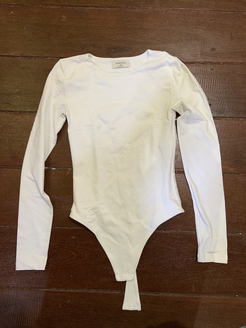 Babaton White Long Sleeve Bodysuit (Category: Others Tops) located in Carmen, Surigao del Sur. Submitted by steph_7 (Listing ID 1454718314, Image 1). Description: BABATON by ARITZIA Long Sleeve Bodysuit 🤍 ₱1,300 (negotiable) (free SF) Size: XS Pre-loved • Good condition • Authentic Babaton by Aritzia • Classic fitted silhouette • Soft & stretchy Contour fabric • Perfect basic for layering or styling with jeans, trousers & skirts • Snap-button cl