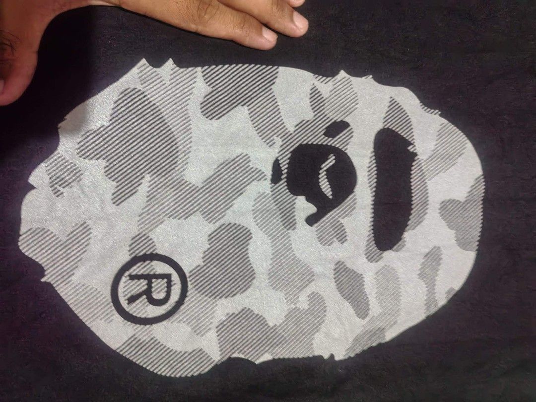 Bathing ape big logo tshirt (Category: Activewear) located in Vinzons. Submitted by kspabico07187 (Listing ID 1454726614, Image 3). Description: Verygood condition No crack print Reflectorized print L-26.5 W-20 No washtag.
