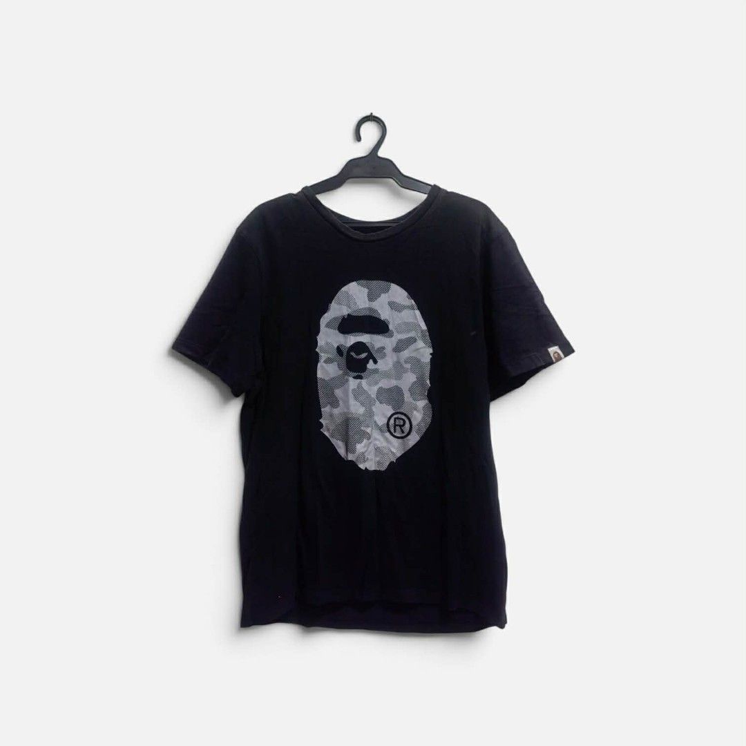 Bathing ape big logo tshirt (Category: Activewear) located in Vinzons. Submitted by kspabico07187 (Listing ID 1454726614, Image 2). Description: Verygood condition No crack print Reflectorized print L-26.5 W-20 No washtag.