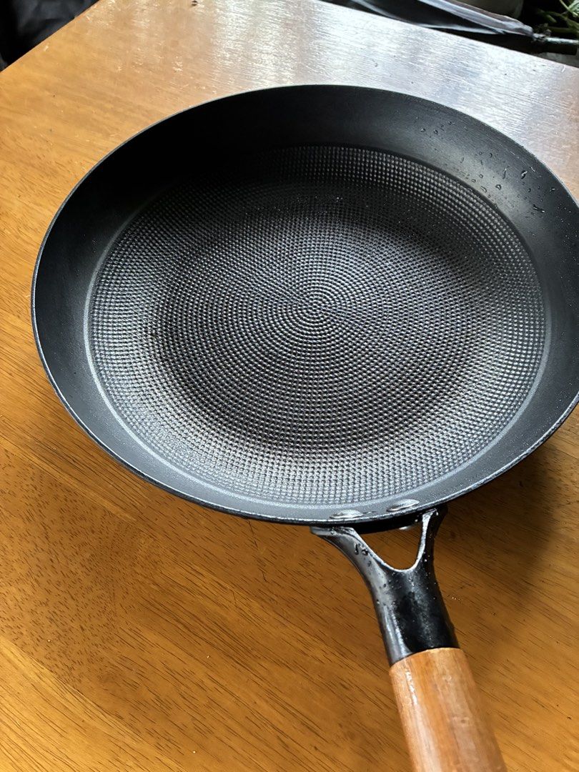 Beka Frying Pan with Wooden Handle (Category: Cookware & Accessories) located in Cavite. Submitted by secondhandnook (Listing ID 1454563562, Image 2). Description: - Beka frying pan - Textured non-stick surface for easy cooking and cleaning - Comfortable wooden handle with secure metal attachment - Ideal for everyday use - Minor water droplets visible (clean and ready to use) - Looking for a new home!.