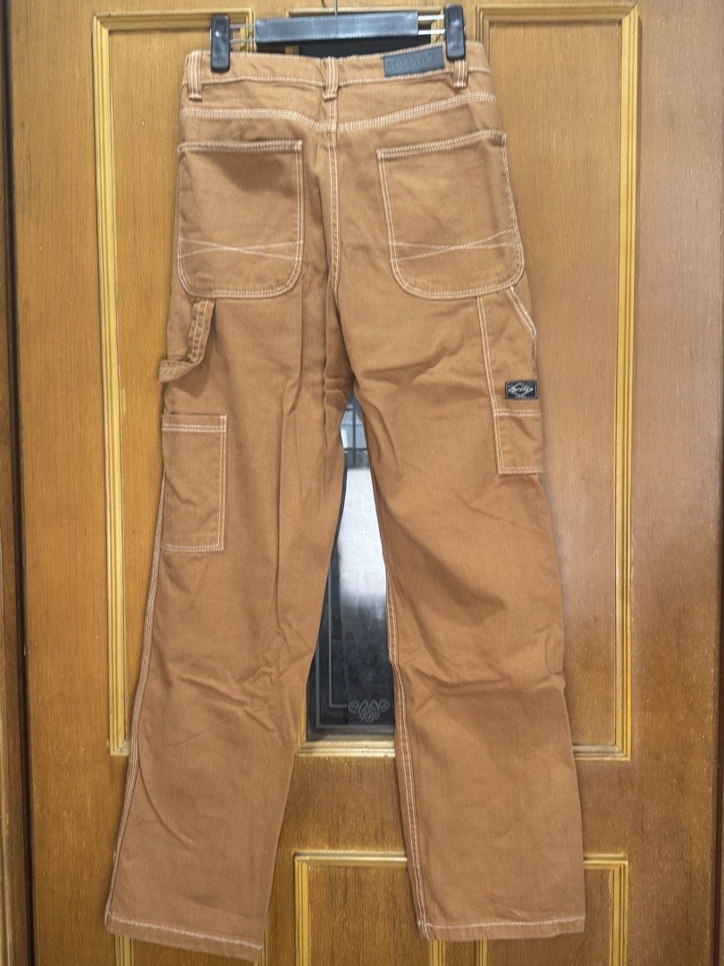 Bershka Tan / Brown Straight Leg Carpenter Pants (Category: Jeans) located in Manila. Submitted by karlahabs (Listing ID 1454725921, Image 2). Description: - Brand: Bershka - Color: Brown / Tan - Style: Carpenter Pants - Fit: Straight Leg - Features: Utility pockets, contrast stitching - Size: 4 US / 26 US - Origin: Made in Bangladesh - Occasion: Great for casual wear.