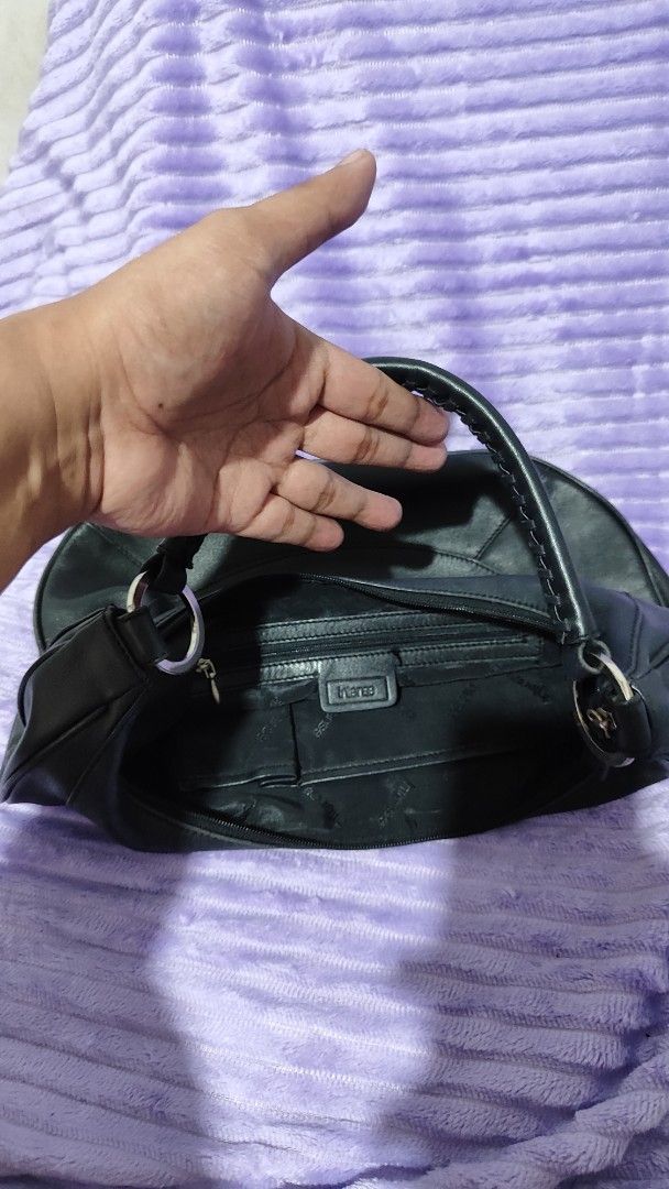 Black Leather Hobo Shoulder Bag (Category: Shoulder Bags) located in Manila. Submitted by thecalvinedit (Listing ID 1454747630, Image 3). Description: - Classic black leather hobo bag - Made from soft leather - Secure zipper closure - Interior zippered pocket and logo tag - Stylish silver hardware details - Comfortable shoulder strap - Ideal everyday bag.