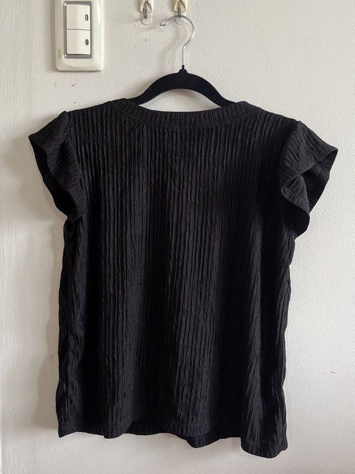 Black Pleated Top (Category: Blouses) located in Muntinlupa City. Submitted by lovedbysabel (Listing ID 1454624720, Image 1). Description: Bought during my Vietnam trip. A staple piece for your wardrobe! Has a flowy cut on the shoulders, making it comfy to wear while still looking put-together! .