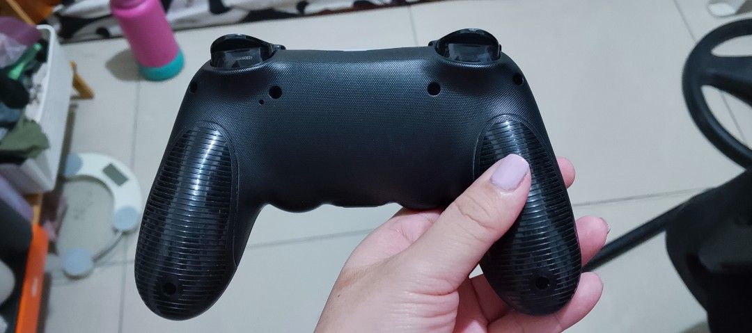 Black Wireless Game Controller for PlayStation 4 (Category: Controllers) located in Manila. Submitted by diolatasuz19927 (Listing ID 1454677325, Image 2). Description: - Black Wireless Controller - For PlayStation 4 only not compatible with pc or other devices. - Tested and fully functional - Ready for your next gaming session - Bought in datablitz original price 1200 - Almost brand new - Rfs: PS4 already been sold, no longer being used..