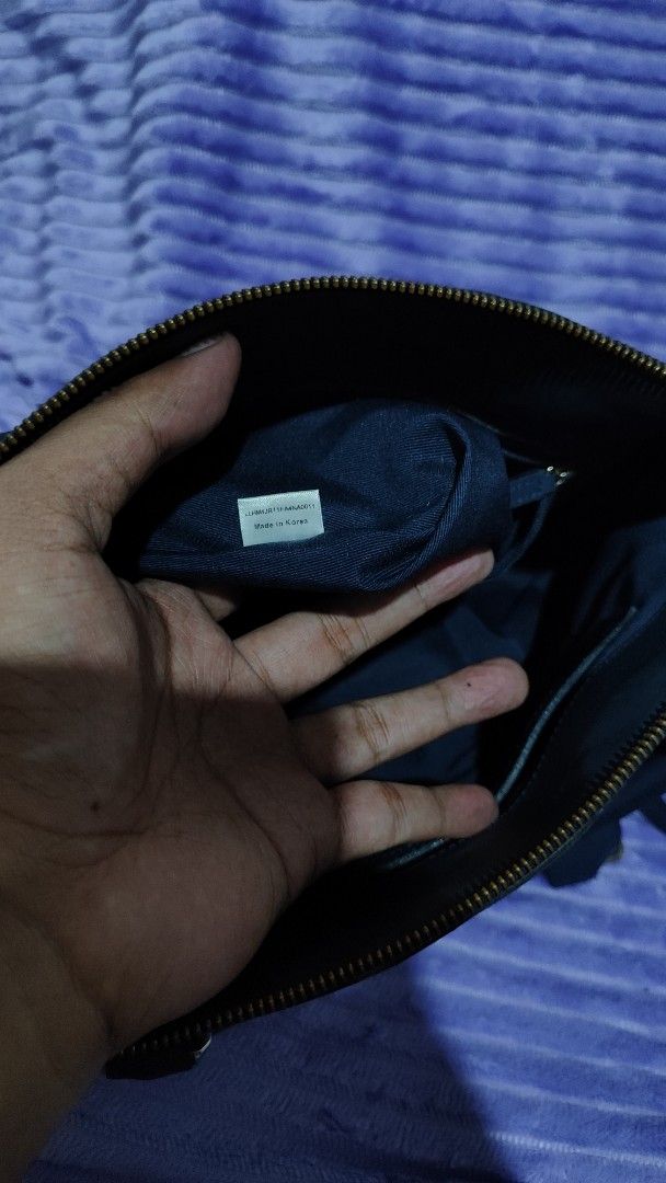Blue Leather Handbag with Shoulder Strap (Category: Shoulder Bags) located in Manila. Submitted by thecalvinedit (Listing ID 1454748279, Image 3). Description: - Chic blue leather handbag - Features a comfortable top handle - Includes a detachable shoulder strap for versatile wear - Organized interior with multiple compartments - Proudly made in Korea - Please note: Minor wear on handles and corners, as shown in photos..