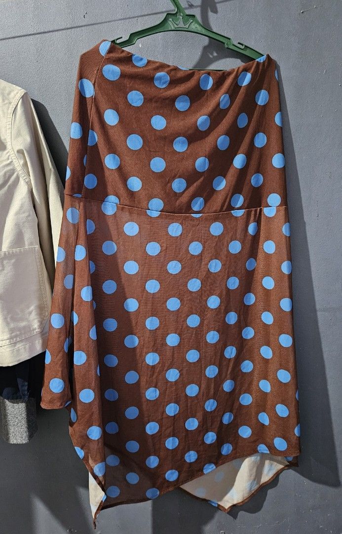 RelaGala Brown Polka Dot Mesh Long Skirt (Category: Dresses) located in Quezon City. Submitted by ajpzn_ (Listing ID 1454564514, Image 1). Description: - Brown long skirt with charming light blue polka dots - Unique asymmetrical hemline - Made from a flowy, comfortable material - Ideal for casual outings or fun events - Effortless to wear and style - A truly unique piece to add to your wardrobe!.