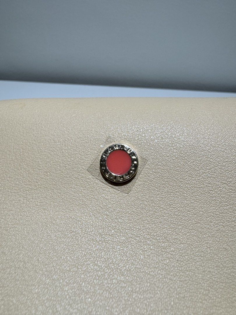 Bvlgari Emirates Exclusive Cosmetic Bag (Category: Luxury Bags & Wallets) located in Quezon City. Submitted by joyeusefille (Listing ID 1454597780, Image 2). Description: - Cream-colored cosmetic bag - Features a small red and gold emblem on the front - Secure zipper closure - Lined with pink fabric inside - Branded with 'Bvlgari Parfums' and 'Emirates' - Ideal for travel or everyday essentials.