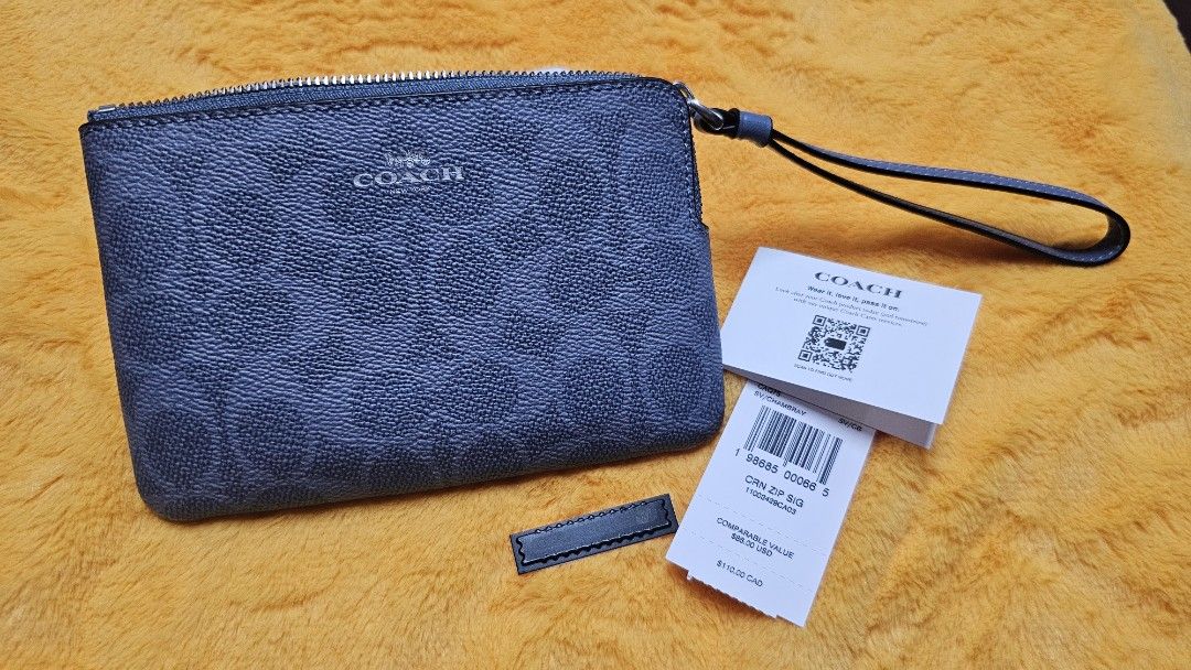 C0ACH ZIP Wristlet Chambray (Original) (Category: Luxury Bags & Wallets) located in Pateros City. Submitted by chichachanceonestopshoppe (Listing ID 1454660684, Image 1). Description: C0ACH ZIP Wristlet Chambray (Original) *Color may vary due to lighting Php 2500 only (below srp).