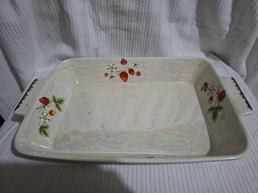 Pearlized Baking Dish (Category: Bakeware) located in Consolacion. Submitted by luxekerei (Listing ID 1454682133, Image 1). Description: - vintage iridescent ceramic baking dish features a charming country-style wild strawberry and white blossom pattern with integrated side handles..