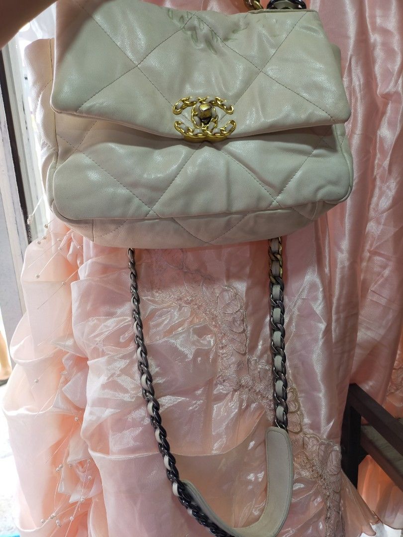 Chanel 19 Bag Cream Leather (Category: Luxury Bags & Wallets) located in Manila. Submitted by new-opening (Listing ID 1454589920, Image 1). Description: - Cream Chanel 19 Bag - Quilted Leather - Gold and Silver Chain Strap - Front Pocket - Minor marks on front flap - Suitable for everyday or special occasions - Comes with dust bag.