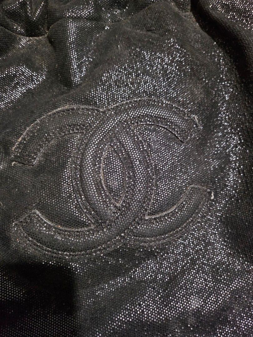 Chanel Drawstring Bag with Chain Strap (Category: Luxury Bags & Wallets) located in Pinamalayan. Submitted by braveheartfiftyfive (Listing ID 1454669207, Image 2). Description: - Chic sparkly black drawstring bag - Features iconic embossed Chanel CC logo - Elegant silver chain strap - Secure drawstring closure - Unique textured material - needs cleaning - Ideal for carrying your daily essentials - medium size.