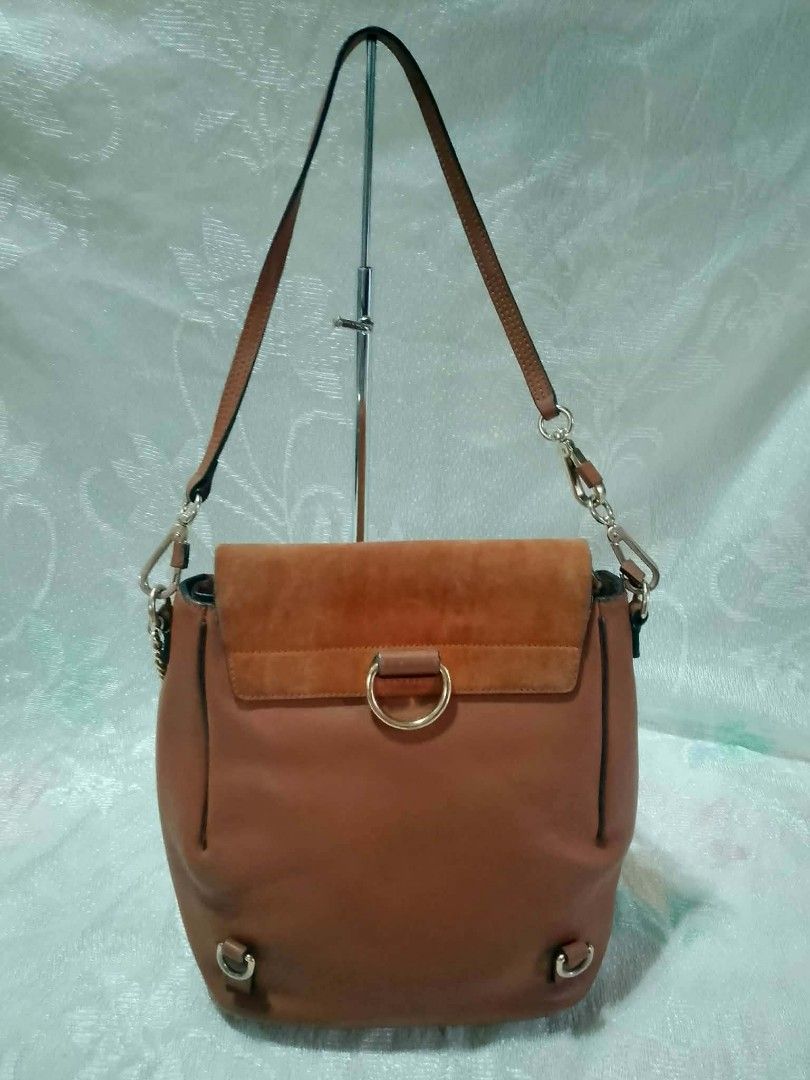 Chloé Faye backpack (Category: Luxury Bags & Wallets) located in Tuguegarao City. Submitted by starzeke (Listing ID 1454746895, Image 2). Description: Chloé Faye backpack features a distinct suede front flap secured by a signature ring and chain closure. [1, 2].