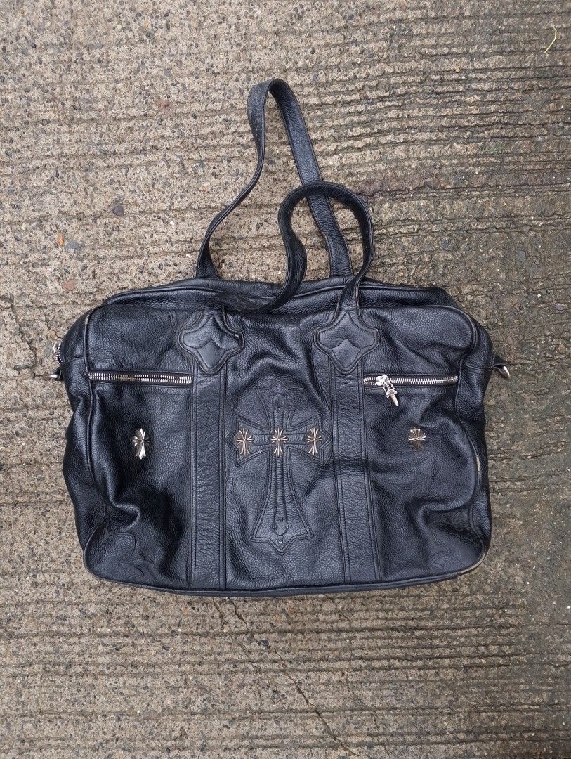 Chrome Hearts Pebbled Leather Bag / Duffel (Category: Luxury Bags & Wallets) located in Baliuag. Submitted by retrovault83 (Listing ID 1454635411, Image 1). Description: Chrome Hearts Pebbled Leather Bag / Duffel ( OFF ONLY ) Front Overlay: Stitched Leather Cemetery Cross patch accented with 3 Silver CH Cross Rivets. Zipper Pulls: Dagger Zip Pulls across compartments (Note: 1 zipper is missing its dagger pull). Exterior Side Studs: Silver Plus/Cr