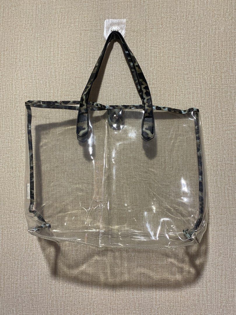 Clear Tote Bag with Leopard Print Pouch (Category: Tote Bags) located in Manila. Submitted by cdb_22 (Listing ID 1454748435, Image 3). Description: - Comes with a clear tote bag and a matching leopard print pouch. - Pouch features a secure zipper closure. - Ideal for beach days or everyday errands. - Clear tote allows for easy visibility of contents. - Handles are made of durable leopard print material. - The pouch fits conveniently inside the cl