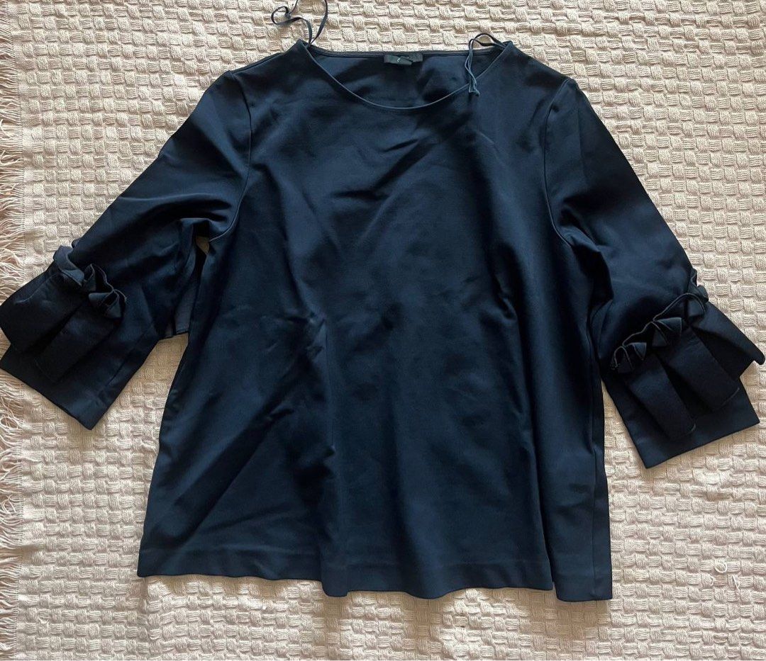 COS Navy Blue Ruffle Sleeve Top Size M (Category: Blouses) located in Mandaluyong City. Submitted by beangoose (Listing ID 1454584253, Image 3). Description: - Navy blue top from COS - Unique ruffle details on sleeves - Three-quarter length sleeves - Crew neck - Size Medium - Perfect with white trousers or jeans.
