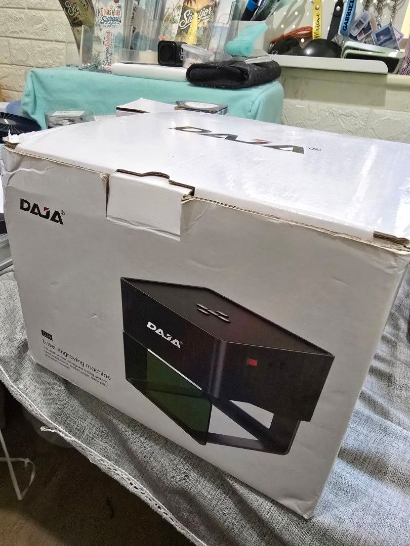 DAJA Laser Engraving Machine with Mobile App Connection (Category: Office & Business Technology) located in Paranaque City. Submitted by rekeep (Listing ID 1454716693, Image 2). Description: - DAJA Laser Engraver - Connects to your phone via mobile app - Ideal for personalizing wood slices, wallets, tumblers, and more - Safety glasses included - Original box included - Ready for your creative projects.