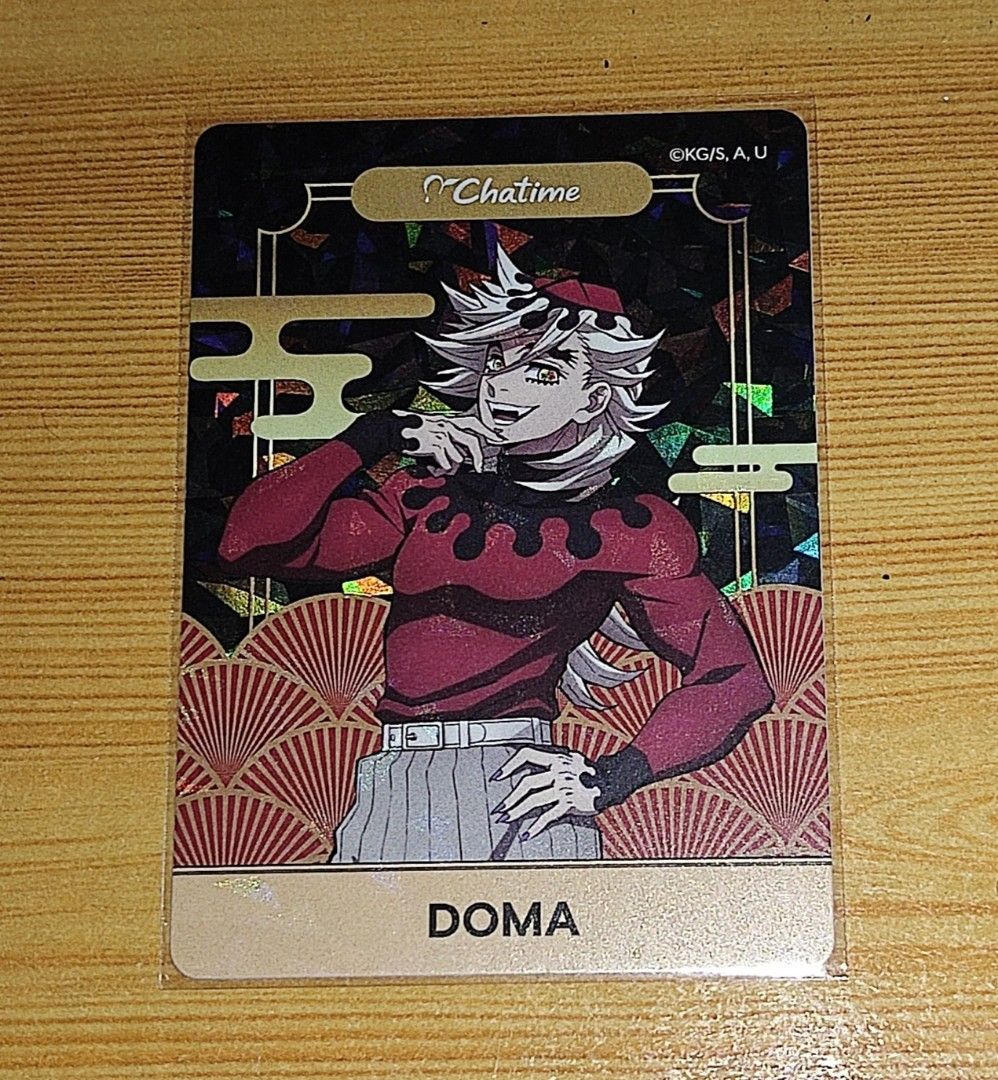 Chatime x Demon Slayer Doma Card (Category: Raw Singles) located in San Mateo. Submitted by warmdog-fe66 (Listing ID 1454658587, Image 1). Description: - Authentic Demon Slayer Doma card from Chatime. - Features a stunning holographic design. - A must-have for collectors. - Meet ups: Cubao Gateway or Alimall. - Shipping via J&T shouldered by the buyer..