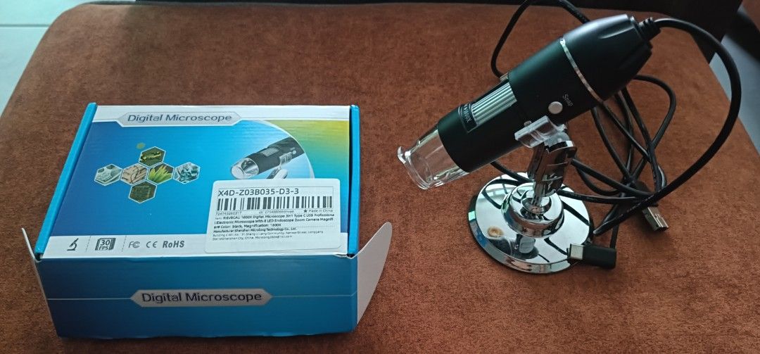 Digital microscope (Category: Craft Supplies & Tools) located in Singapore. Submitted by murphy1975 (Listing ID 1454666994, Image 1). Description: - brought but didn't use - Digital microscope with stand - Black color - Comes with original box - Ideal for detailed observation and exploration - USB to Android phone and window PC laptop .