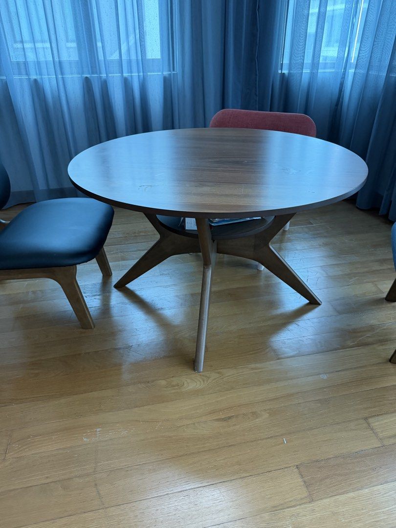 Dining table coffee table (Category: Tables & Sets) located in Kuala Lumpur. Submitted by trueshark-f545c0 (Listing ID 1454618508, Image 1). Description: - Round wooden dining table - Unique, sculptural base - Seats 4 people comfortably - Ideal for small dining areas or breakfast nooks - Visible wood grain on tabletop - Chairs are not included.