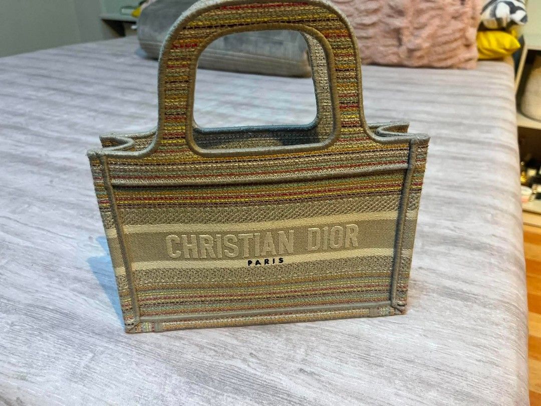 Dior mini tote (Category: Luxury Bags & Wallets) located in Marikina City. Submitted by kgcdl (Listing ID 1454722888, Image 1). Description: - Authentic Christian Dior Paris tote bag - Unique striped canvas design with Dior logo - Integrated handles for a seamless look - best copy only purchased around 20k . with box - Spacious enough for daily essentials - A chic and versatile accessory.