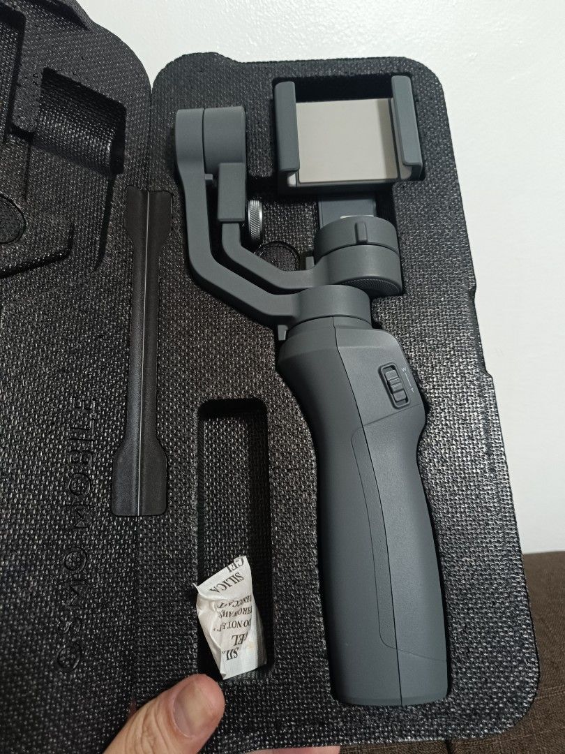 DJI Osmo Mobile 2 Gimbal Stabilizer for Smartphones (Category: Gimbals & Stabilizers ) located in Makati City. Submitted by billyun (Listing ID 1454716051, Image 2). Description: Almost new di masyado nagamit - Refurbished DJI Osmo Mobile 2 gimbal - Achieve incredibly smooth video footage - Compatible with most smartphones - Comes with original packaging and accessories - Ready for your creative projects.